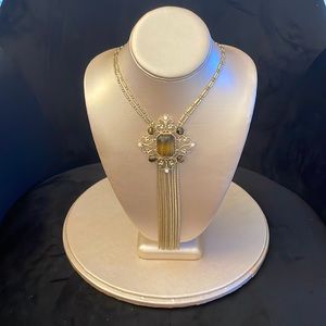 Brand new Gold Broach tassel necklace, up to 28 inches around